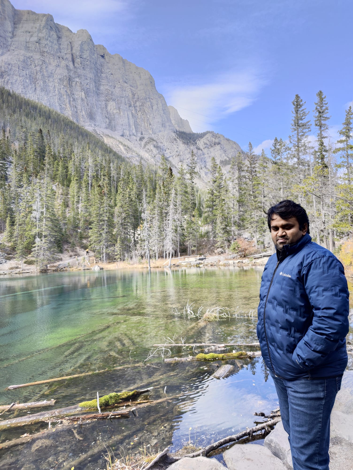 Jahid Hassan by a mountain lake in the Canadian Rockies near Calgary